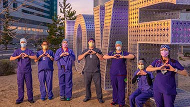 Providers in front of LOVE sculpture